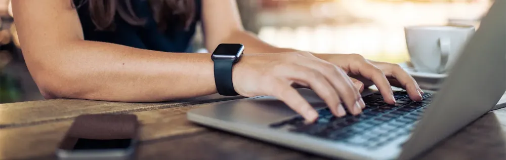 Woman on Laptop Writing Bad Reviews